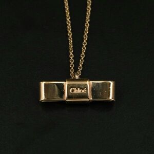 Chloe Gold Tone Ribbon Bow Pendant Necklace